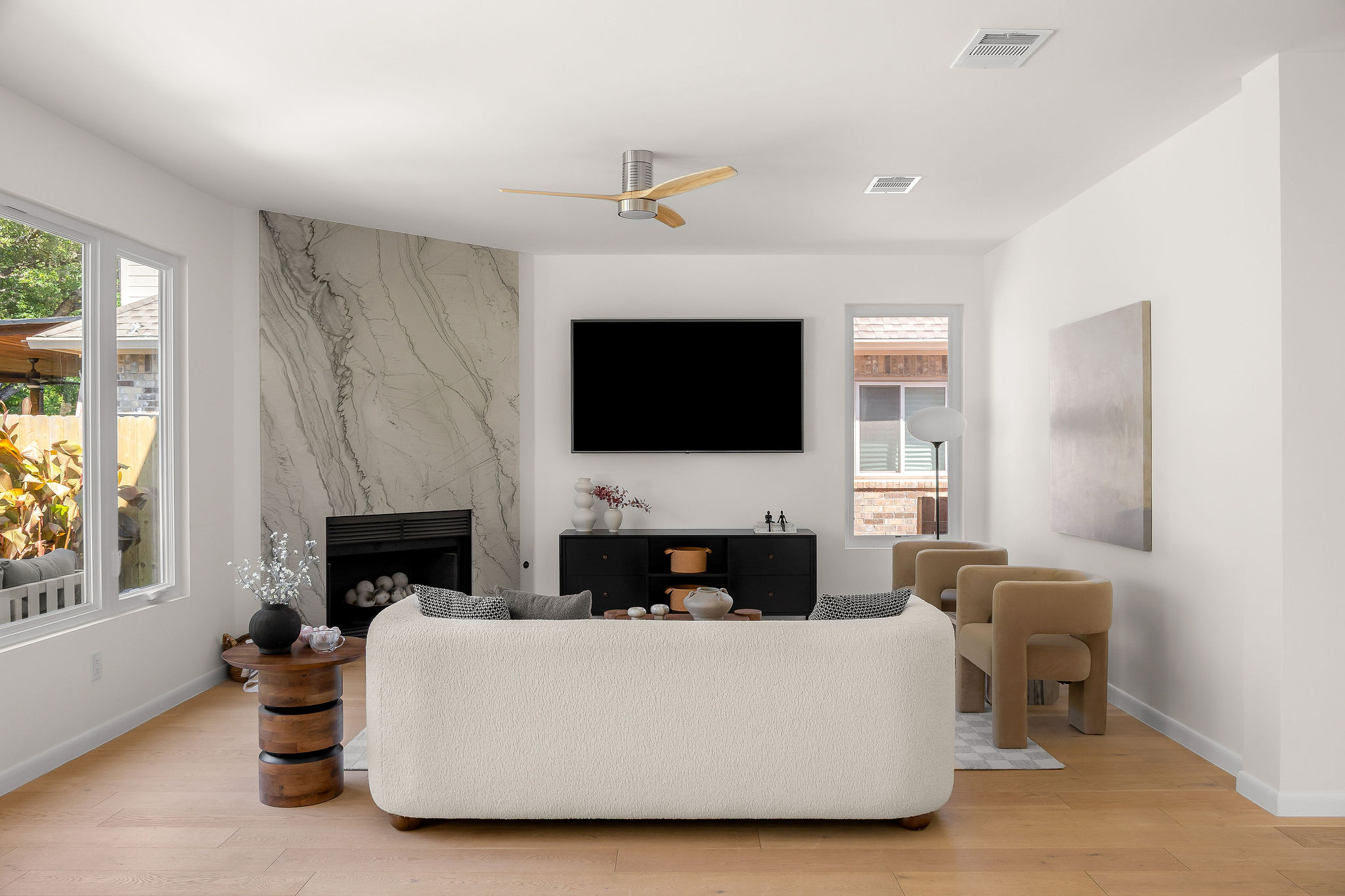 6500 Clay Allison Pass Austin, TX 78749 - Photo 13 of 39 Bright living area featuring a striking fireplace with a natural stone surround and a built-in firebox