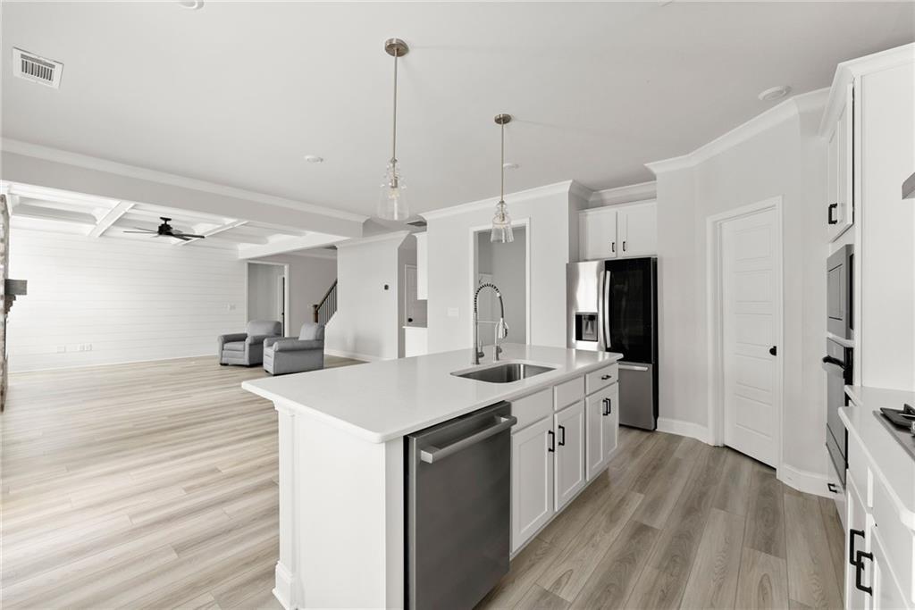 6109 Black Pearl Lane Gainesville, GA 30506 - Photo 7 of 14 a kitchen with a sink stove and refrigerator