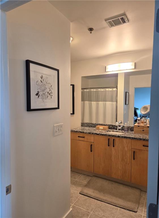 250 Pharr Road Northeast, Unit 1816 Atlanta, GA 30305 - Photo 20 of 36 a kitchen with stainless steel appliances granite countertop a stove a sink and a refrigerator