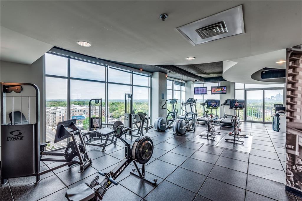 250 Pharr Road Northeast, Unit 1816 Atlanta, GA 30305 - Photo 30 of 36 a room with lots of tables and chairs