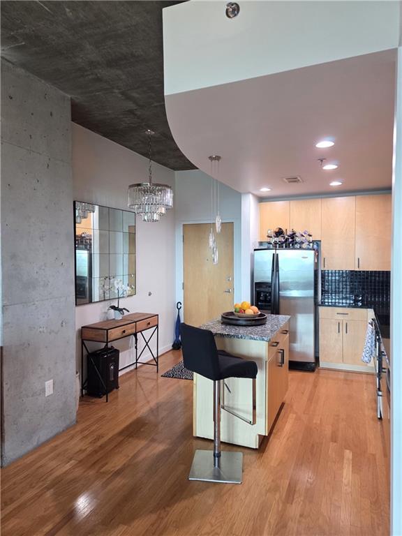 250 Pharr Road Northeast, Unit 1816 Atlanta, GA 30305 - Photo 3 of 36 a view of a kitchen and dining room