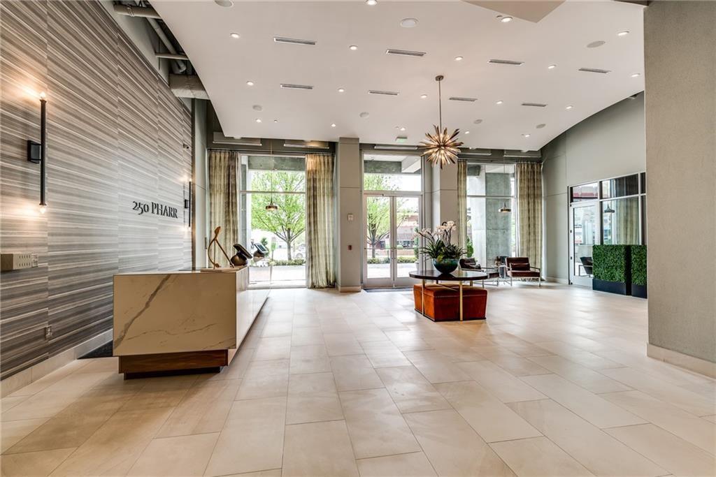 250 Pharr Road Northeast, Unit 1816 Atlanta, GA 30305 - Photo 34 of 36 a large living room with furniture and a large window