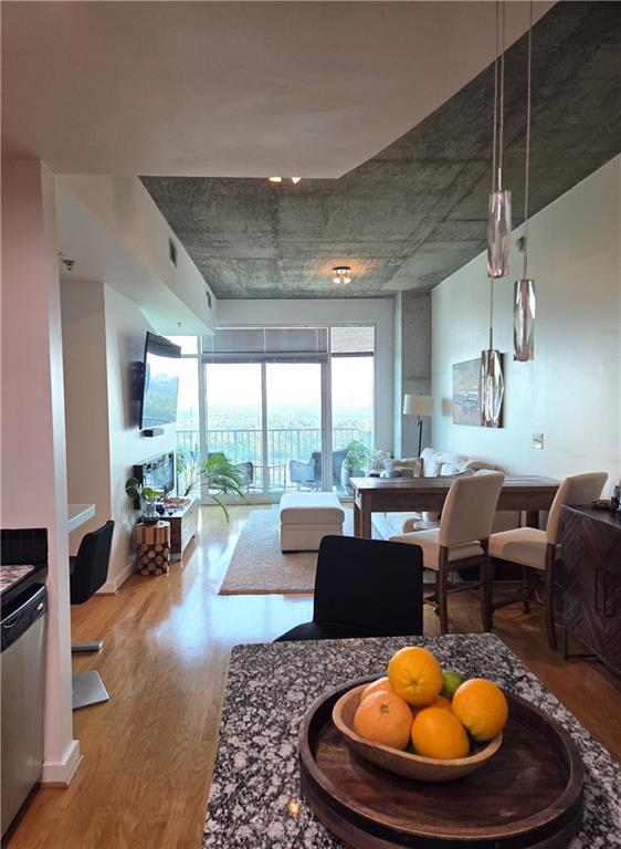 250 Pharr Road Northeast, Unit 1816 Atlanta, GA 30305 - Photo 7 of 36 a living room with furniture and a large window