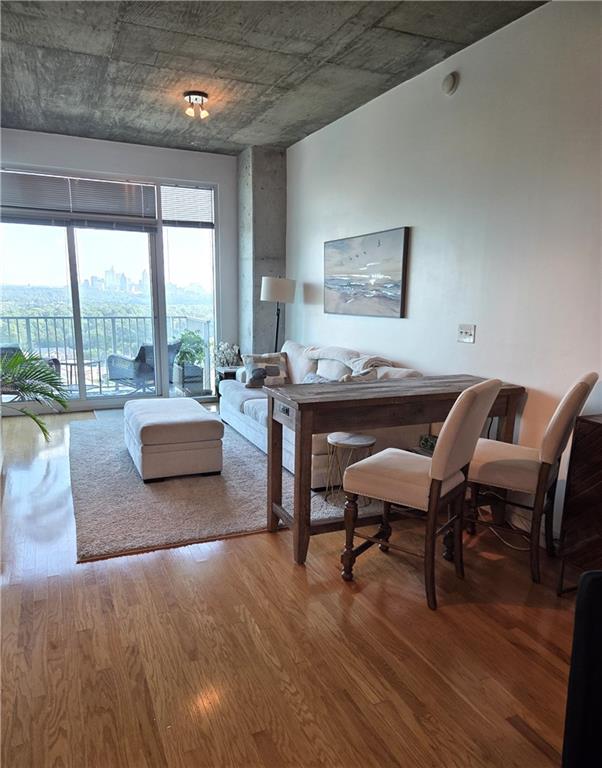 250 Pharr Road Northeast, Unit 1816 Atlanta, GA 30305 - Photo 9 of 36 a living room with furniture and a large window