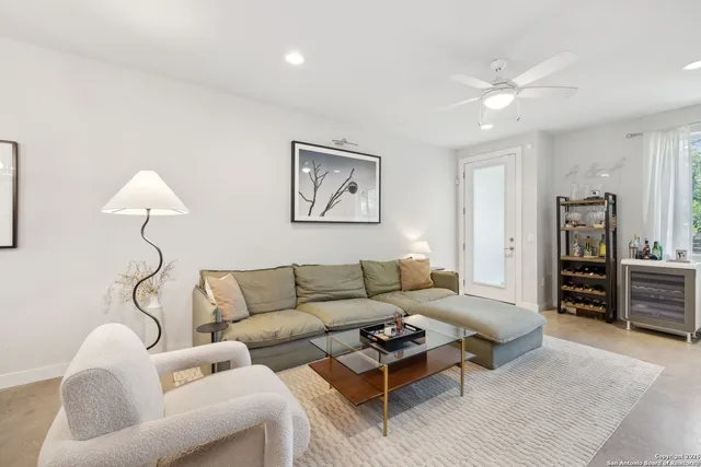 a living room with furniture a couch and a table