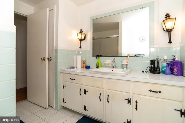 a view of a house with pool and a yard