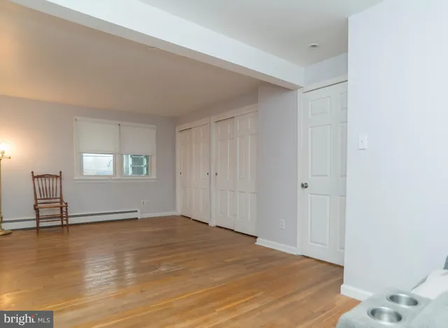 a living room with a couch and a fireplace