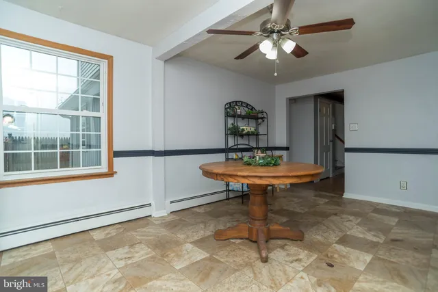 a kitchen with a refrigerator and a sink