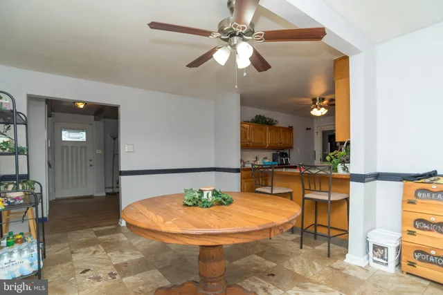 a kitchen with stainless steel appliances granite countertop a refrigerator and cabinets