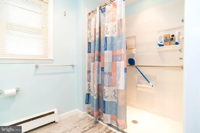 a view of empty room with wooden walls