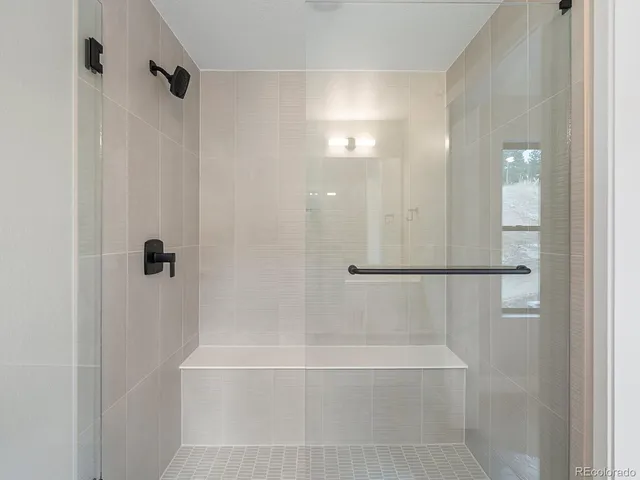 a bathroom with a bathtub and a toilet