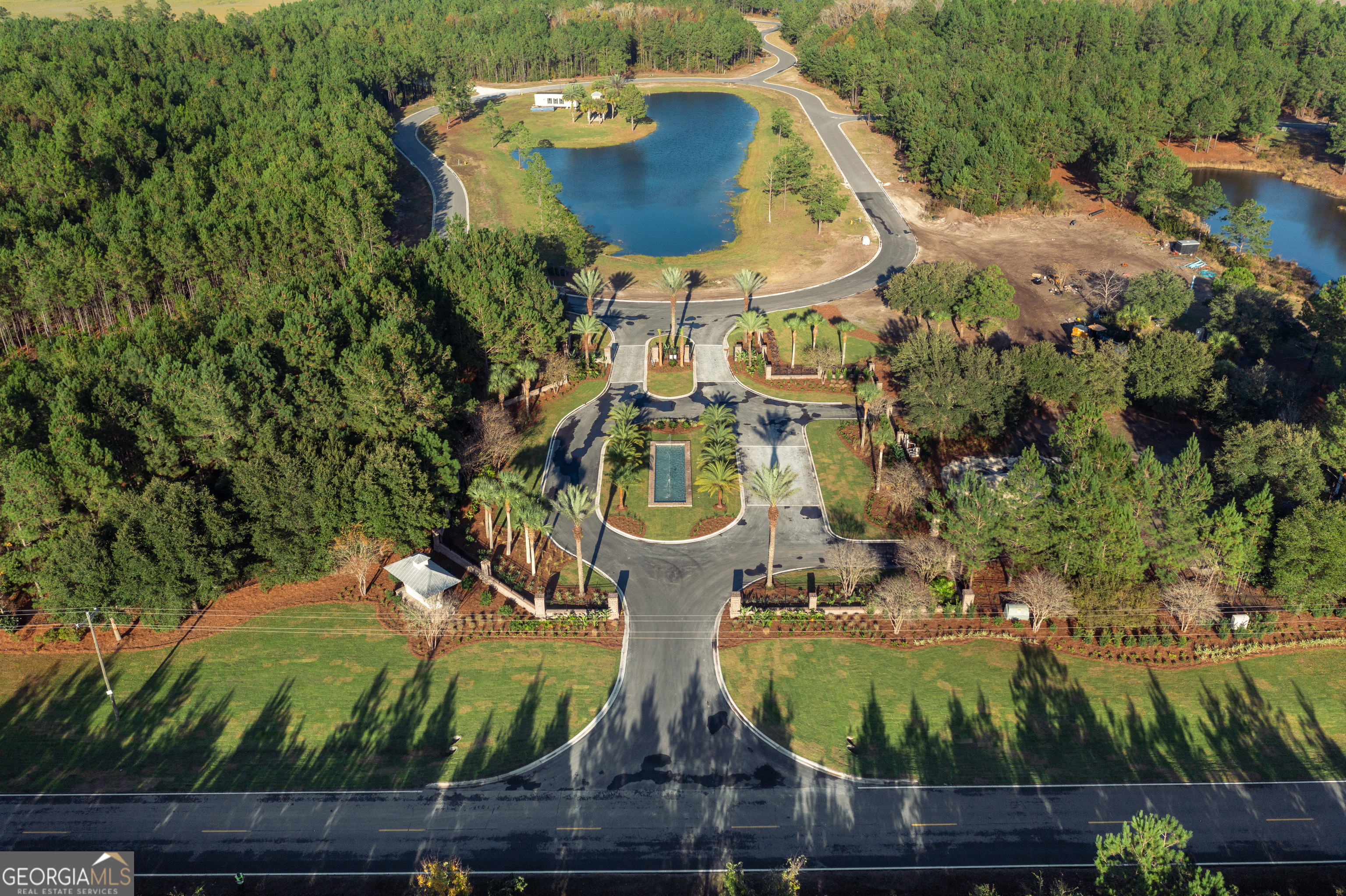 Lot 526 Beacon Pointe Parkway Waverly, GA 31565 - Photo 2 of 15 a view of a fountain in middle of the house