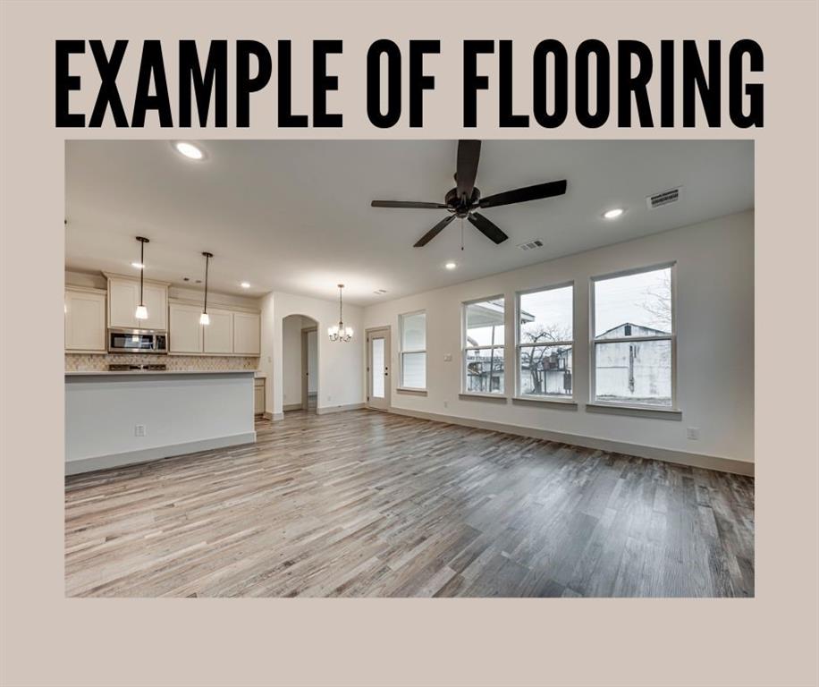 4 Slate Rock Road Ennis, TX 75119 - Photo 11 of 13 a living room with kitchen wooden floor and a large window