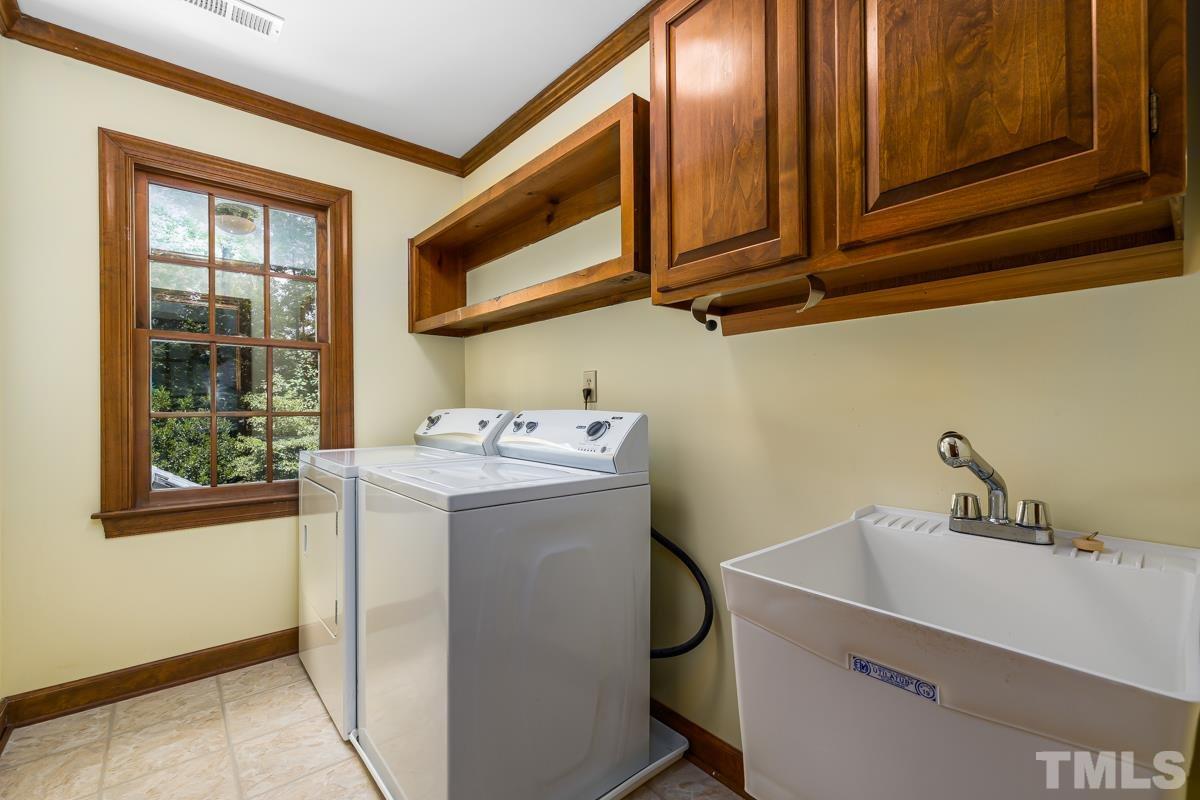 812 Thatcher Way Raleigh, NC 27615 - Photo 22 of 30 a utility room with dryer and washer
