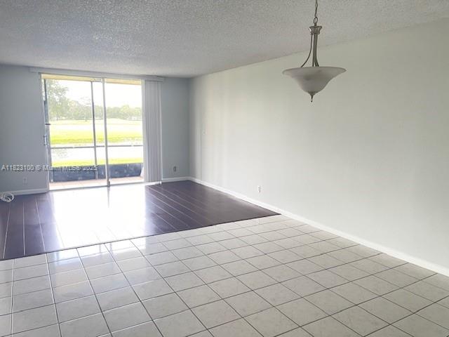 3100 West Rolling Hills Circle, Unit 101 Davie, FL 33328 - Photo 4 of 12 a view of an empty room and window