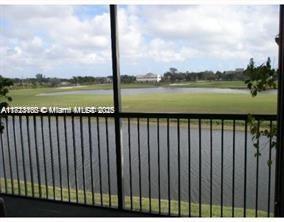 3100 West Rolling Hills Circle, Unit 101 Davie, FL 33328 - Photo 5 of 12 a balcony with lake view