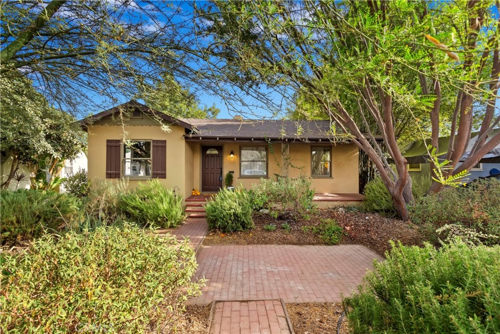 4443 Linwood Place Riverside, CA 92506 - Photo 1 of 1 a front view of a house with garden