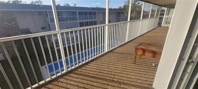 a view of a balcony with window