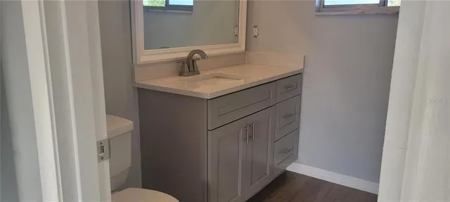 a bathroom with a sink and mirror