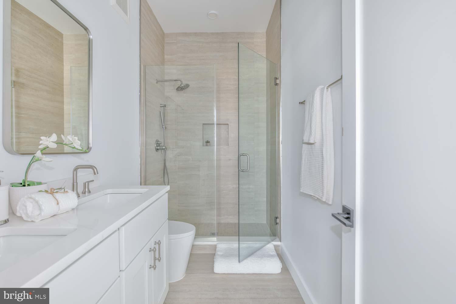 4347 Harrison Street Northwest, Unit 4 Washington, DC 20015 - Photo 11 of 16 a bathroom with a sink a toilet and shower
