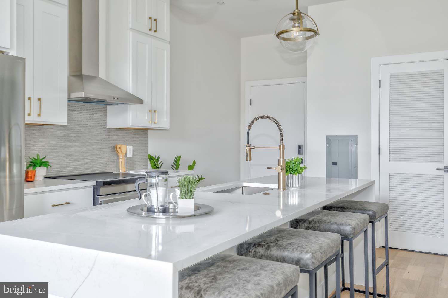 4347 Harrison Street Northwest, Unit 4 Washington, DC 20015 - Photo 7 of 16 a kitchen with a table and chairs