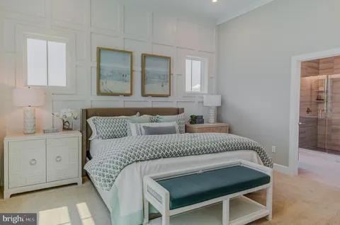 a bedroom with a bed and a lamp