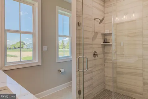 a bathroom with a bathtub and shower