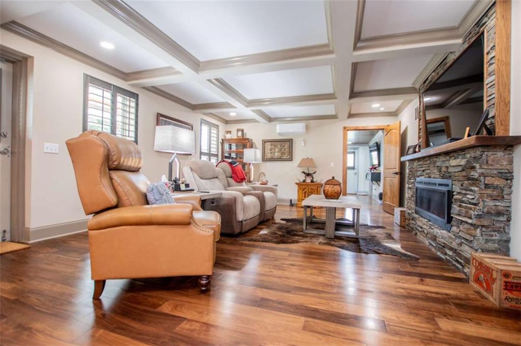 2070 Lovvorn Road Carrollton, GA 30117 - Photo 15 of 98 a living room with furniture or fireplace and a wooden floor