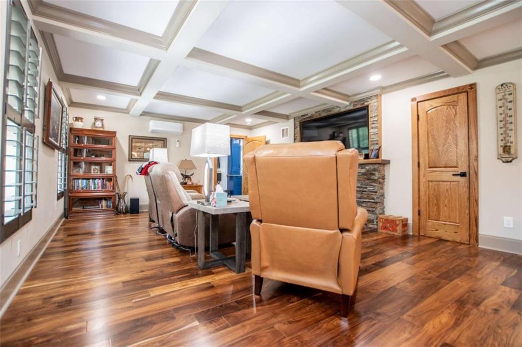 2070 Lovvorn Road Carrollton, GA 30117 - Photo 16 of 98 a living room with furniture and a wooden floor