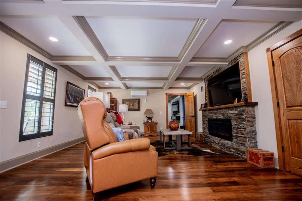 2070 Lovvorn Road Carrollton, GA 30117 - Photo 18 of 98 a living room with furniture a fireplace and a flat screen tv