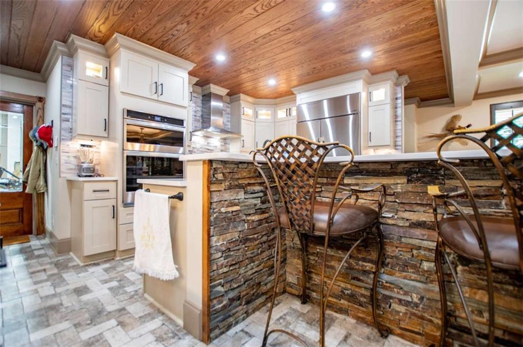 2070 Lovvorn Road Carrollton, GA 30117 - Photo 24 of 98 a view of a kitchen with furniture and refrigerator