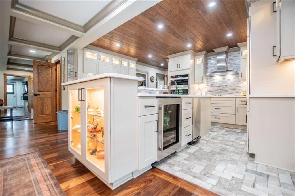 2070 Lovvorn Road Carrollton, GA 30117 - Photo 26 of 98 a kitchen with stainless steel appliances kitchen island granite countertop a refrigerator and stove