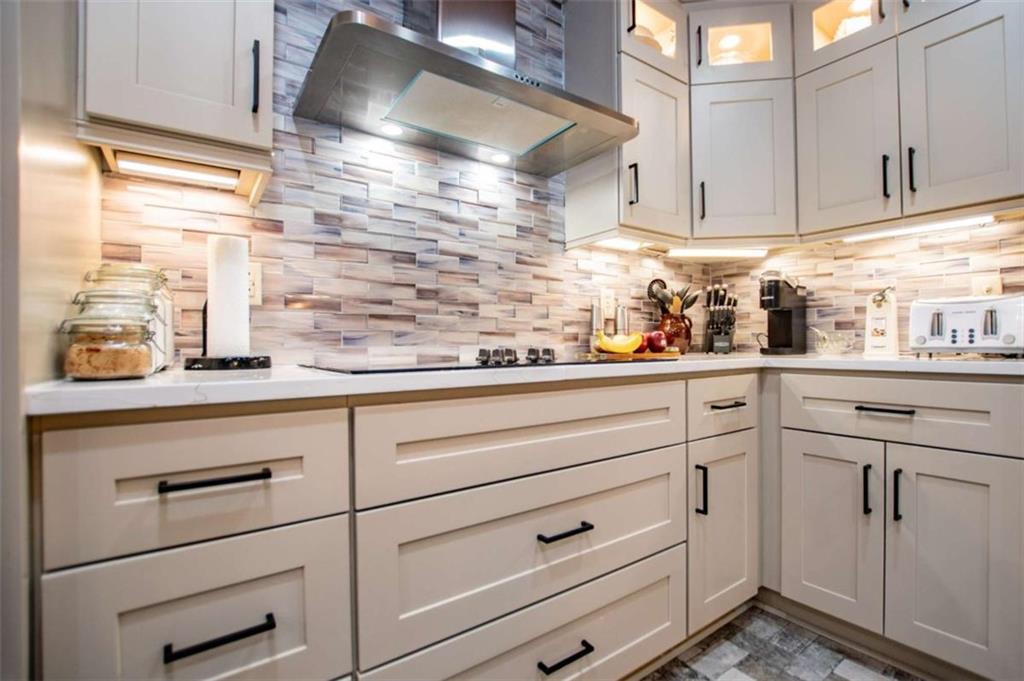 2070 Lovvorn Road Carrollton, GA 30117 - Photo 28 of 98 a kitchen with white cabinets and white appliances
