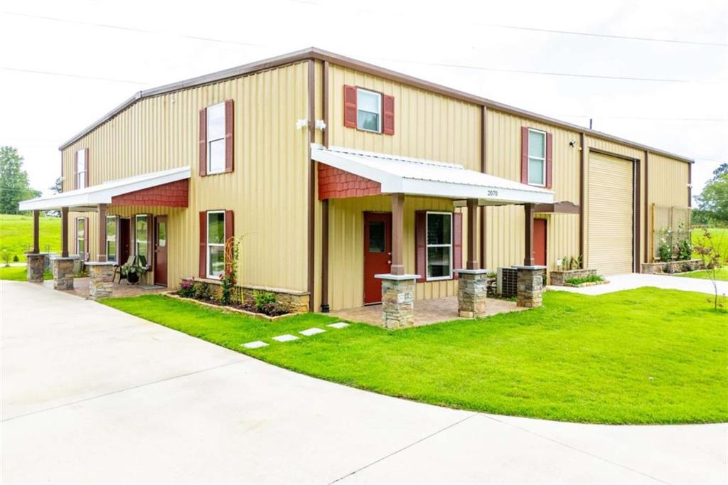 2070 Lovvorn Road Carrollton, GA 30117 - Photo 3 of 98 a view of a house with a yard and sitting area