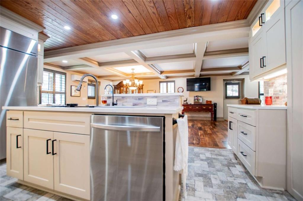 2070 Lovvorn Road Carrollton, GA 30117 - Photo 31 of 98 a kitchen with stainless steel appliances kitchen island granite countertop a refrigerator and a stove top oven