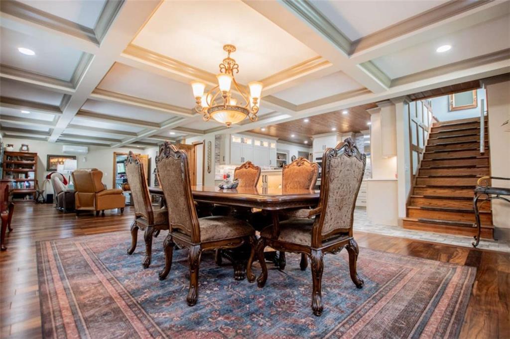 2070 Lovvorn Road Carrollton, GA 30117 - Photo 38 of 98 a view of a dining room with furniture wooden floor and chandelier