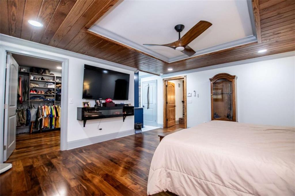 2070 Lovvorn Road Carrollton, GA 30117 - Photo 40 of 98 a bedroom with a bed and a flat screen tv