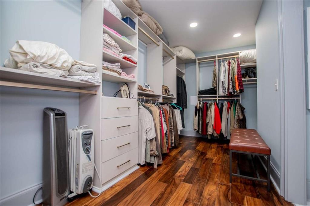 2070 Lovvorn Road Carrollton, GA 30117 - Photo 59 of 98 a view of walk in closet with clothes and shoes