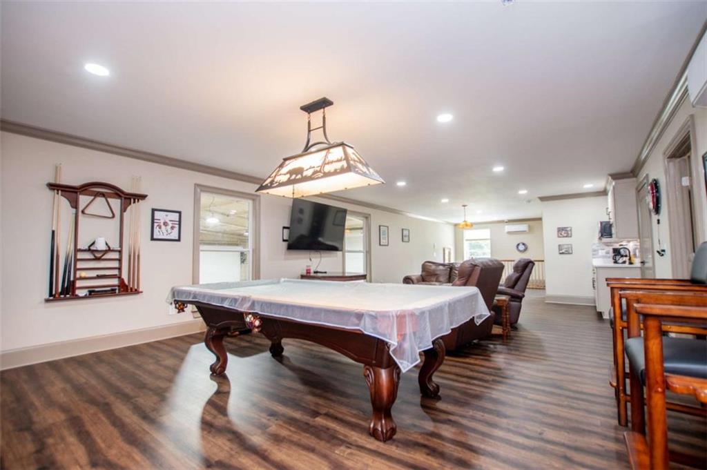 2070 Lovvorn Road Carrollton, GA 30117 - Photo 65 of 98 a view of a dining room with furniture window and wooden floor