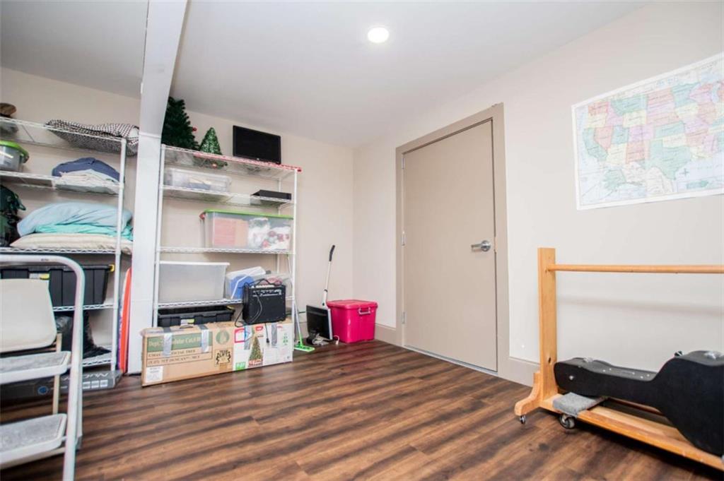 2070 Lovvorn Road Carrollton, GA 30117 - Photo 68 of 98 a view of empty room with wooden floor and fan