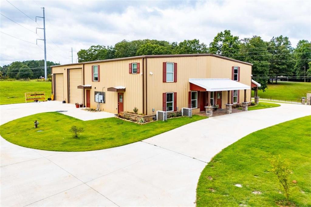 2070 Lovvorn Road Carrollton, GA 30117 - Photo 7 of 98 a view of a house with a swimming pool and a yard