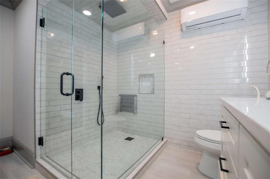 2070 Lovvorn Road Carrollton, GA 30117 - Photo 73 of 98 a bathroom with a shower a toilet and sink