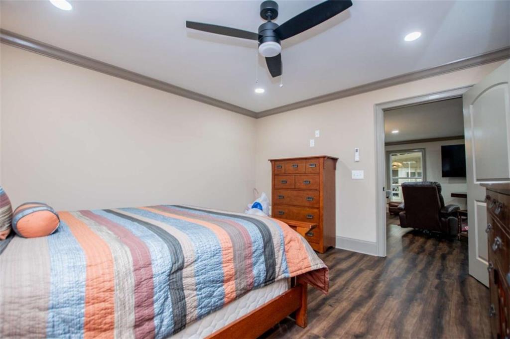 2070 Lovvorn Road Carrollton, GA 30117 - Photo 79 of 98 a bedroom with a bed and wooden floor