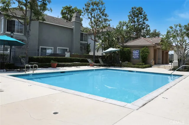 a view of outdoor space with swimming pool and furniture