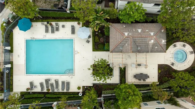 an aerial view of a house with garden space and street view