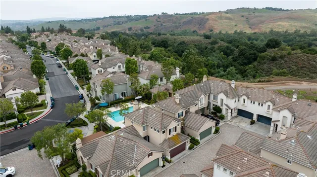 an aerial view of multiple house with mountain view