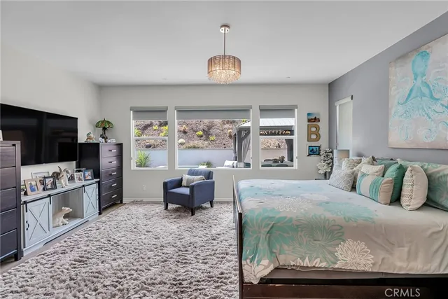 a bedroom with a large bed and a window