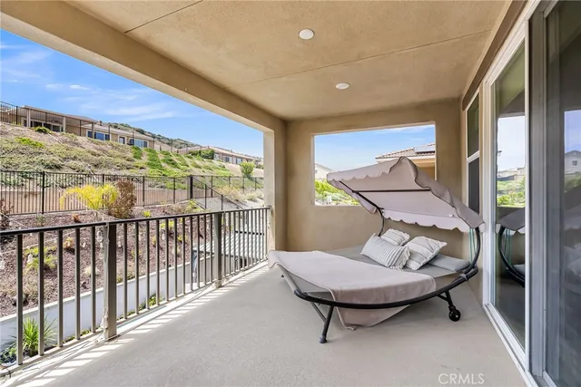 a view of a balcony with furniture