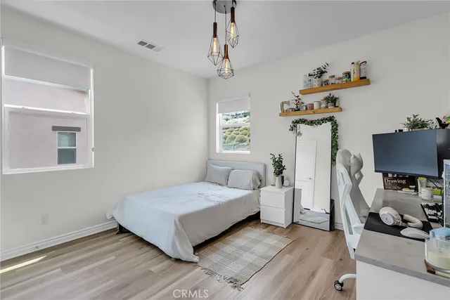 a bedroom with a bed and a chair