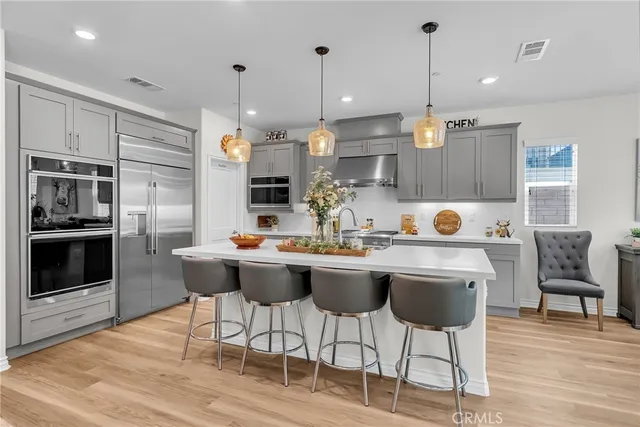 a kitchen with a sink cabinets and stainless steel appliances
